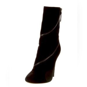Black Alaïa Suede Mid-Calf Moto Boots.